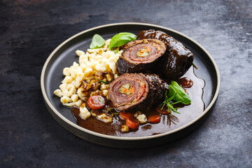 Traditional slow cooked German wagyu beef roulades with spaetzle served in spicy gravy sauce as...