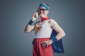 Confident superhero having a phone call