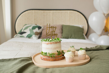 Baking cakes and cupcakes on a tray in the bedroom interior