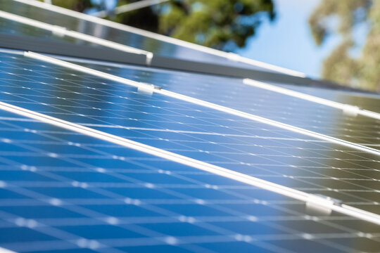 Solar panels on a house roof. Selective focus in the center of image
