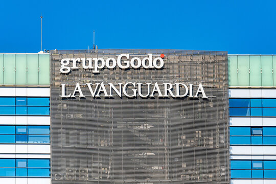 A sign or logo reading Grupo Godo La Vanguardia, Barcelona, Spain