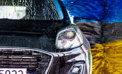 A vehicle in an automatic car wash