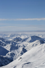 Fototapeta na wymiar Snow-capped mountain range in the Alps