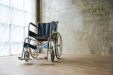 Close up view of empty wheelchair waiting for patient services with vintage filtered.