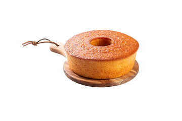 Homemade cornmeal round cake made from corn, typical Brazilian food at a June festival on a wooden board with white background with contact shadow