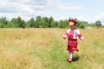 little girl in national Ukrainian clothes - vyshyvanka. Ukraine, child in nature	