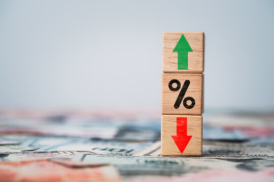 Percentage sign with up and down arrow on dollar banknote for inflation and interest rating increasing concept.