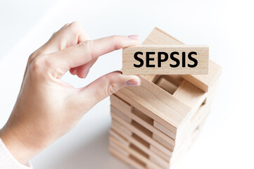 A wooden cubes with the text SEPSIS. View from above. Medical concept