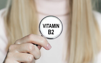 Doctor holding stethoscope with text vitamin b2,medical concept