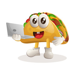 Cute taco mascot working using a laptop