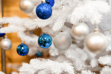 Fototapeta na wymiar Christmas balls decorate a Christmas tree.