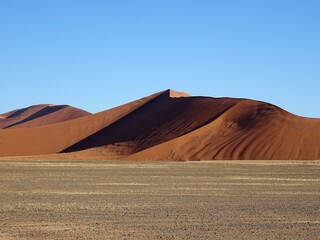 Fototapeta na wymiar sand dunes in the desert at dusk