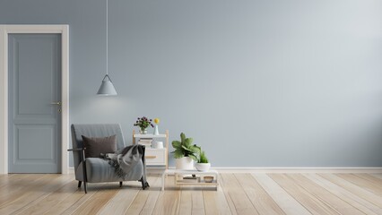 Living room has a armchair on empty blue color wall background.