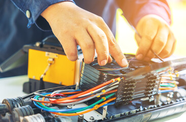 Fusion of Fiber Optics Cable Internet signal splicing and wire connection using equipment, optical...