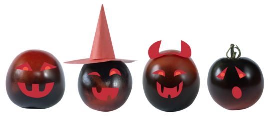 Children's crafts funny and joyful tomatoes dressed up in festive costumes with a hat and horns for Halloween