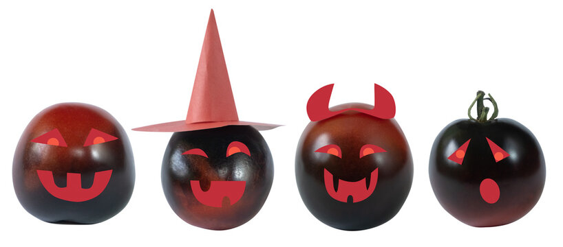 Children's crafts funny and joyful tomatoes dressed up in festive costumes with a hat and horns for Halloween