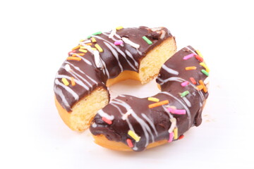 Chocolate sweet mini donuts on white background