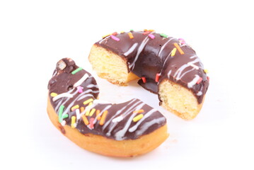 Chocolate sweet mini donuts on white background