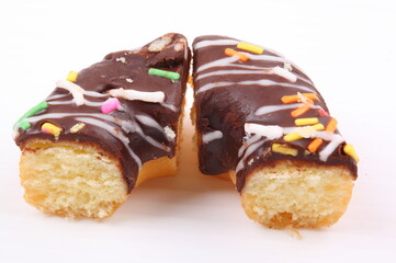 Chocolate sweet mini donuts on white background