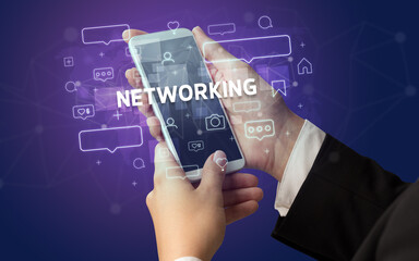 Hand using smartphone with social media concept