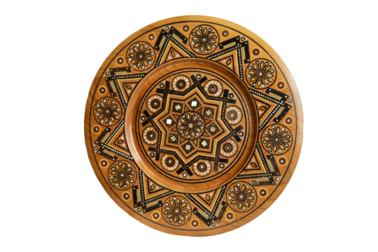 Isolated on white wooden souvenir plate with carved and decorated ornament