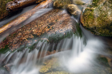 Fototapeta na wymiar Mountain stream with stones with clear water