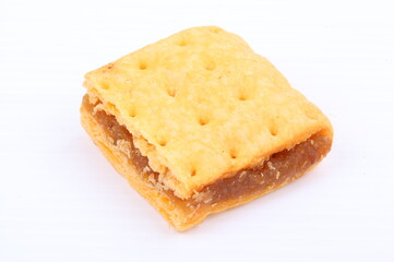Butter cracker with pineapple jam isolated on the white background
