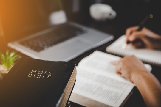 Young Woman Person Hand Holding Holy Bible With Study At Home. Adult Female Christian Reading Book In Church. Girl Learning Religion Spirituality With Pray To God. Concept Of Student Education Faith.