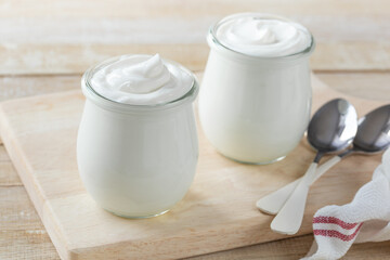Obraz na płótnie Canvas fresh greek yogurt in glass jar