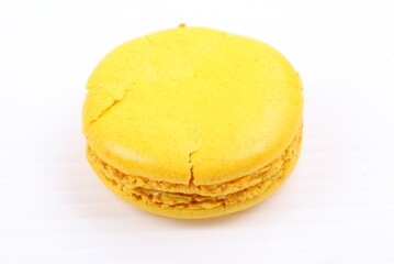 Yellow macaron isolated in white background