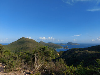 Hiking at the East Dam of High Island Reservoir on Summer. A part of the Hong Kong UNESCO Global Geopark.