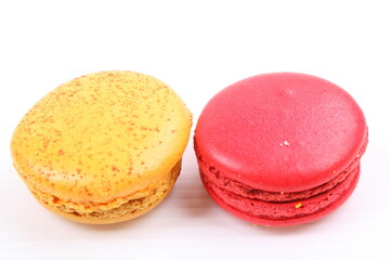 Red and yellow macaron isolated in white background