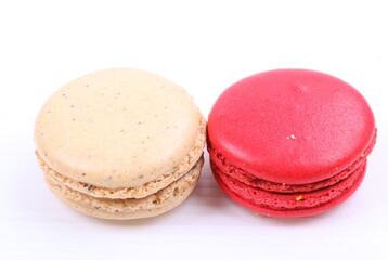 Red and cream macaron isolated in white background