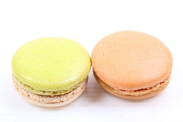 Cream and green macaron isolated in white background