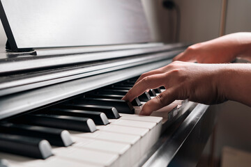 Obraz na płótnie Canvas Close-up Of Man Playing Piano
