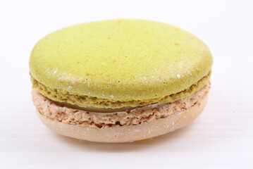 Green macaron isolated in white background