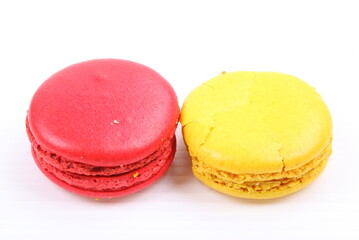 Red and yellow macaron isolated in white background