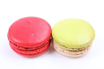 Red and green macaron isolated in white background