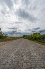 Cobbled road on a cloudy day