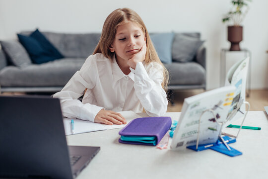 Girl does her homework with pleasure and interest