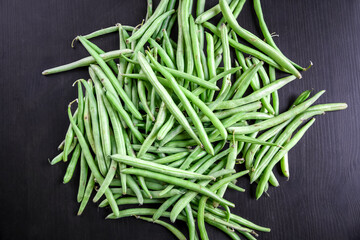 Green beans isolated on black background