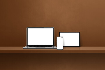 Laptop, mobile phone and digital tablet pc on brown wall shelf. Horizontal background