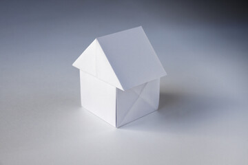 Paper house origami isolated on a white background
