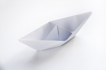 Paper boat origami isolated on a white background