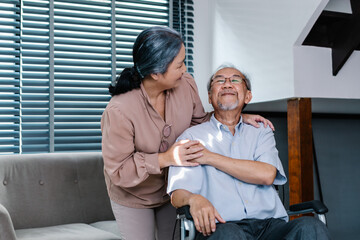 Senior couple take care of each other, Asian Elderly wife take care husband who sitting on wheelchair in house, Healthcare, Happy Life Retirement