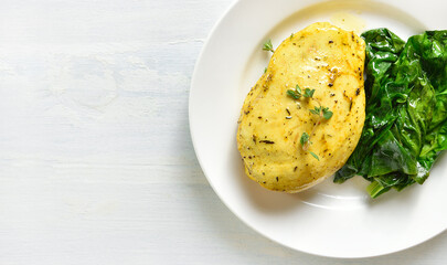 Baked turmeric chicken breast and sauteed spinach