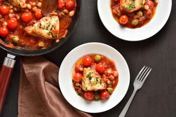 Cod stew with chickpeas, cherry tomatoes and olives