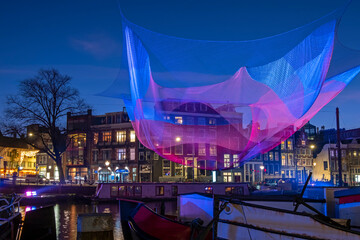 View on Amsterdam during the Light festival in the Netherlands at night.
