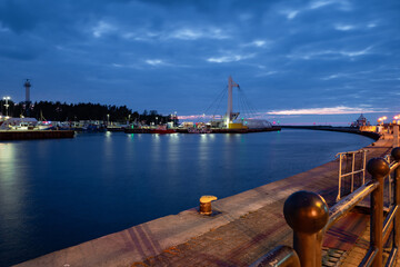 2022-06-02 evening view of quay, harbor and swing bridge at mouth of Slupia at baltic sea. Ustka, Poland © fotomaster