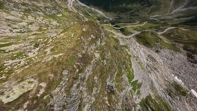 Switzerland Susten Pass mountain pass in the Swiss Alps. Connecting Innertkirchen with Wassen. Aerial flying smooth cliff hiking adventure outdoor speed. Asphalt road over the alps. Aerial.